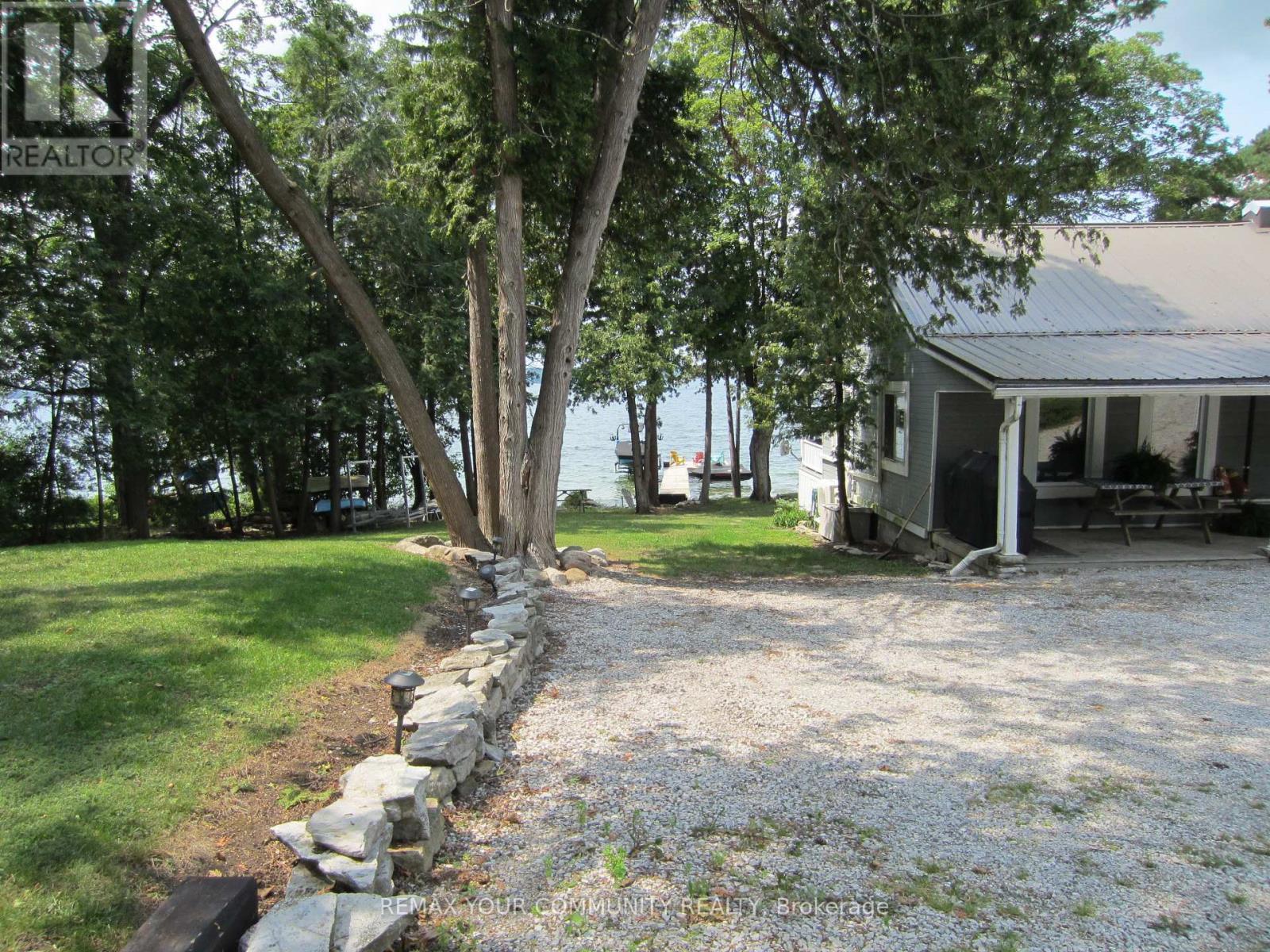 Side of Cottage view to Lake - 6576 Quarry Point Road, Ramara, ON - Outdoor