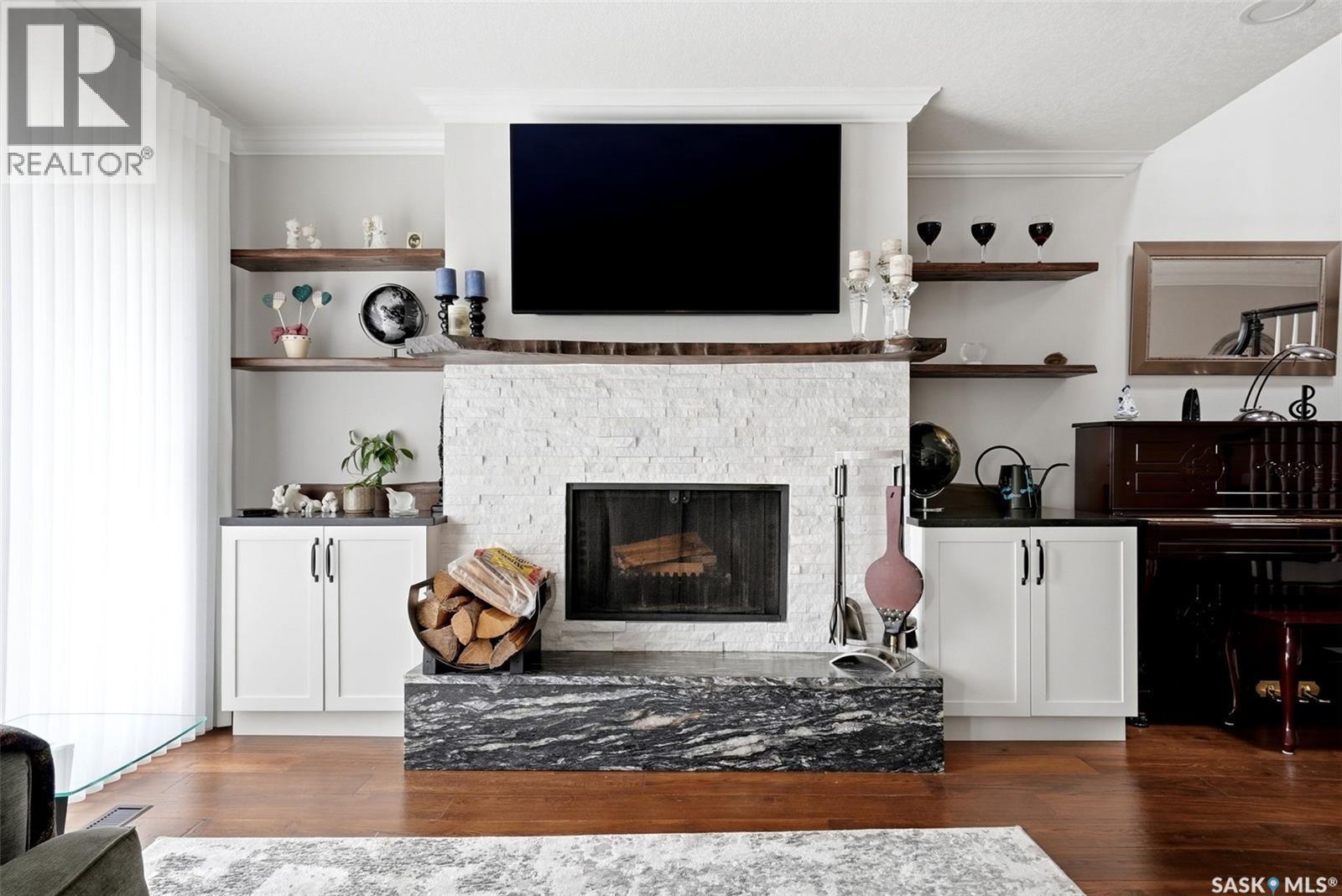 1142 Gryphons Walk, Regina, SK - Indoor Photo Showing Living Room With Fireplace