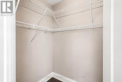 Primary bedroom walk-in closet - 
