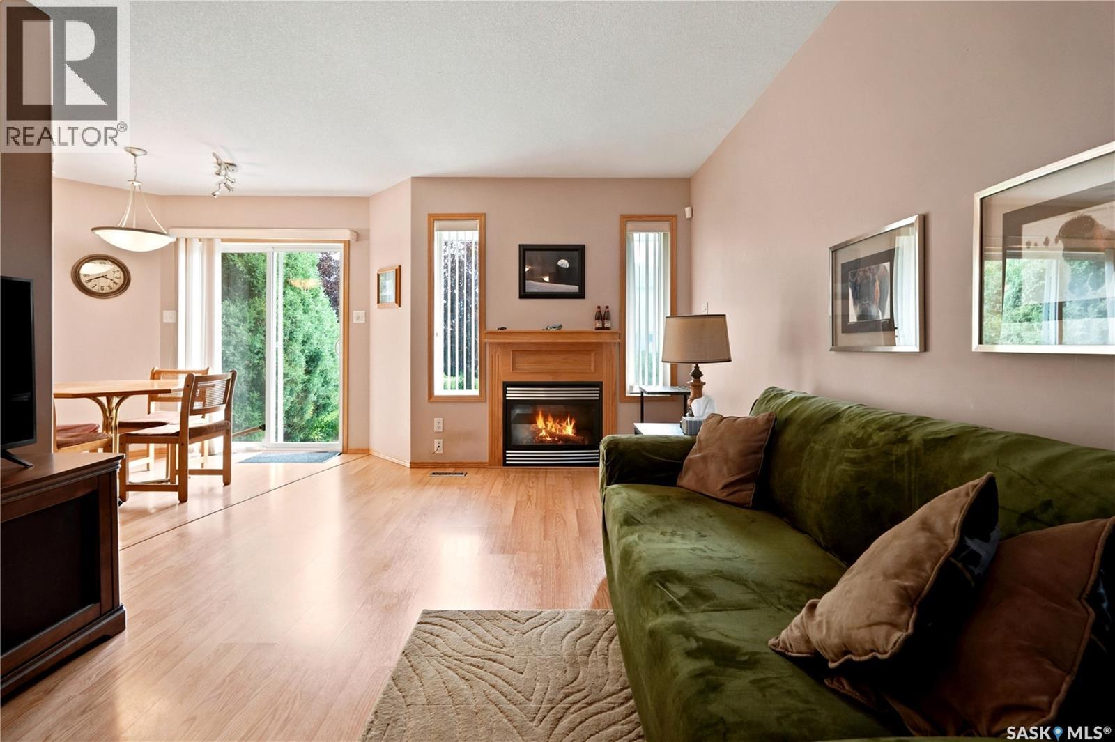 225 Mikkelson Drive, Regina, SK - Indoor Photo Showing Living Room With Fireplace
