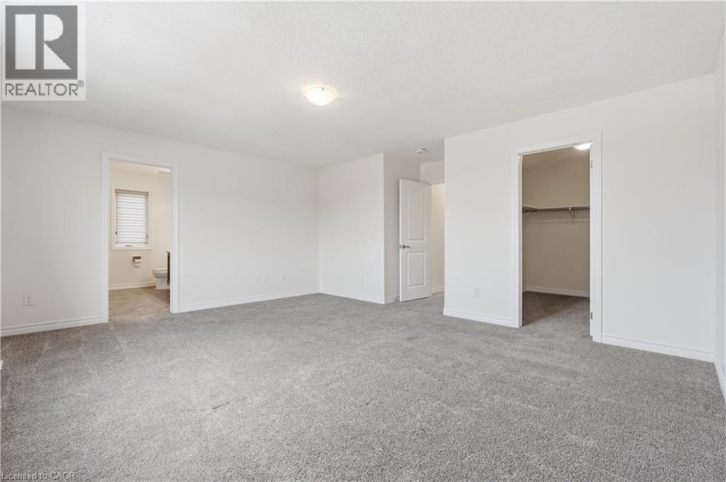 Large primary with 4 piece en suite and walk in closet - 359 Beechdrops Drive, Waterloo, ON - Indoor Photo Showing Other Room