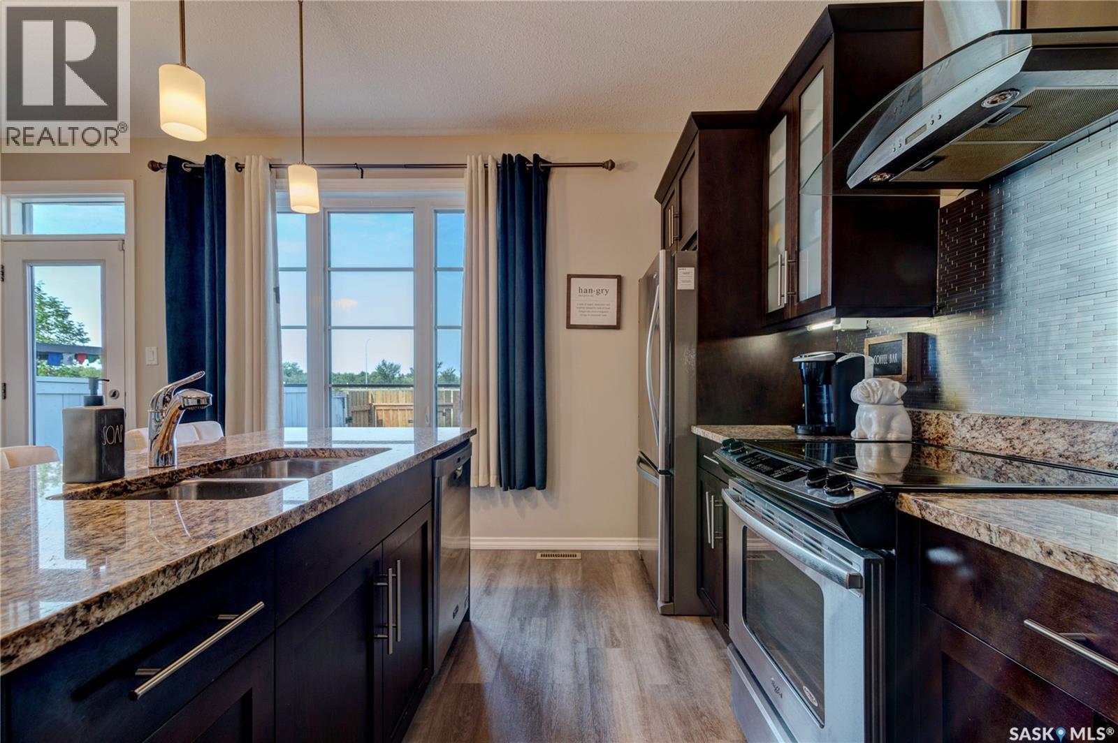 137 3229 Elgaard Drive, Regina, SK - Indoor Photo Showing Kitchen With Double Sink