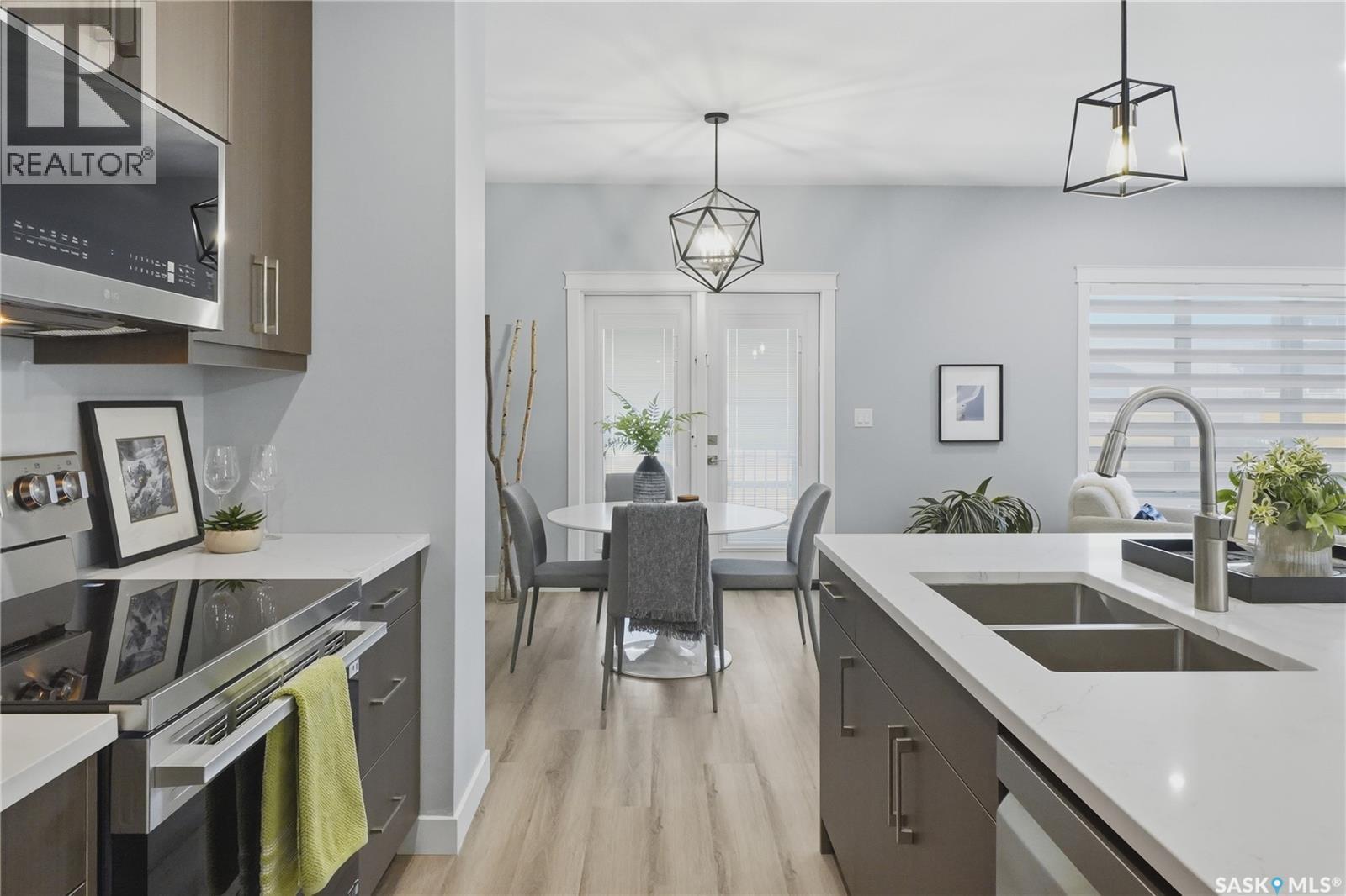 143 Sharma Lane, Saskatoon, SK - Indoor Photo Showing Kitchen With Stainless Steel Kitchen With Double Sink With Upgraded Kitchen