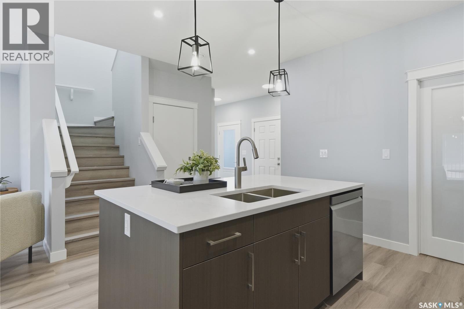143 Sharma Lane, Saskatoon, SK - Indoor Photo Showing Kitchen With Double Sink