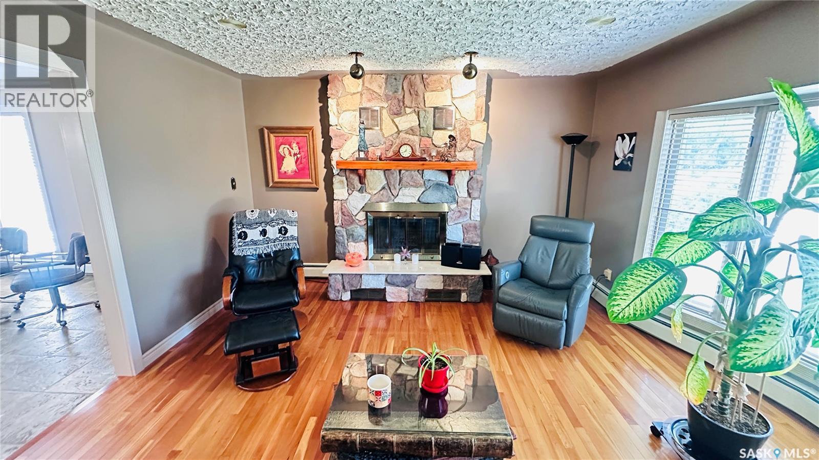 816 1St Avenue, Zenon Park, SK - Indoor Photo Showing Living Room With Fireplace
