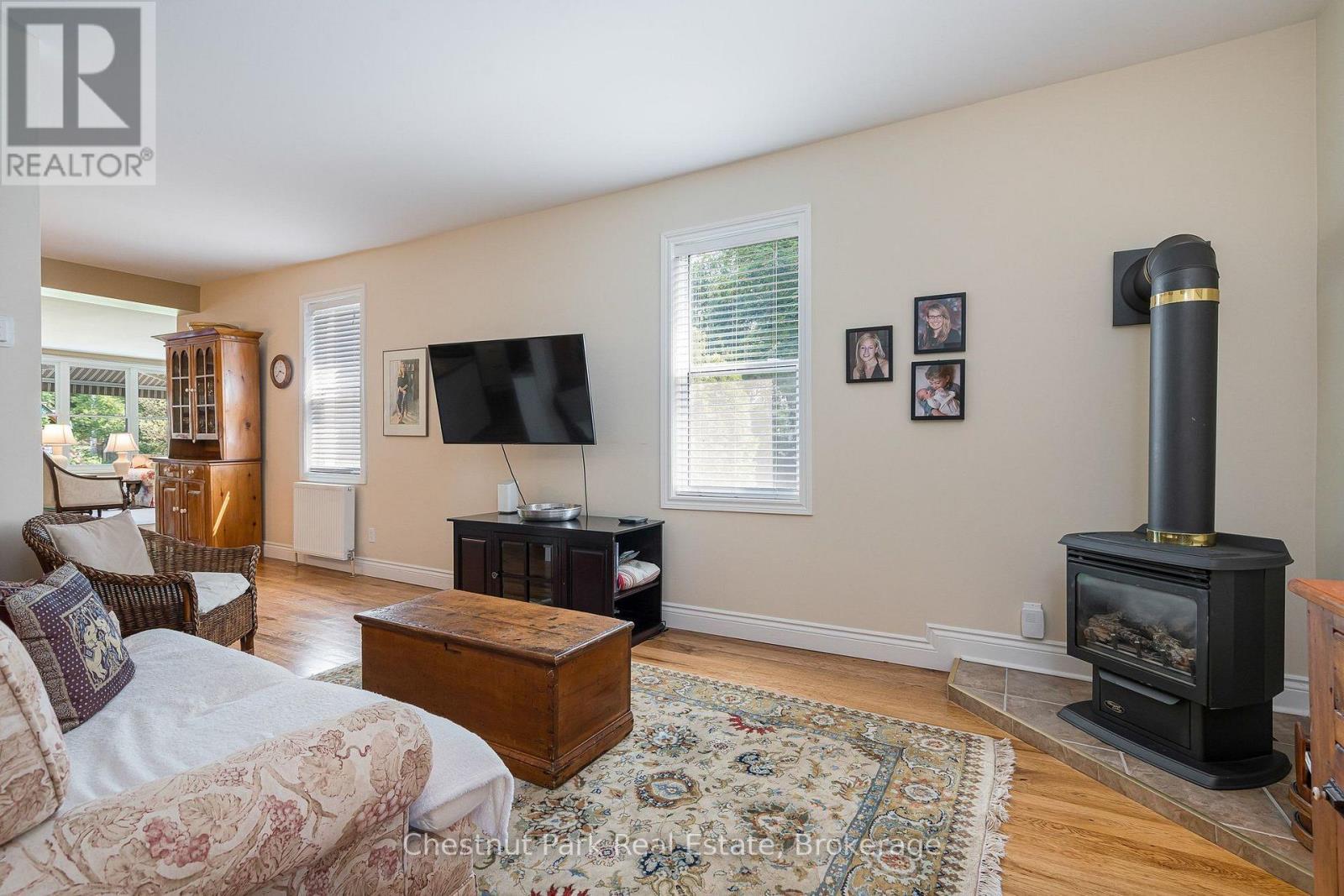 Cozy family room with gas stove - 71 Hickory Street, Collingwood, ON - Indoor Photo Showing Living Room With Fireplace