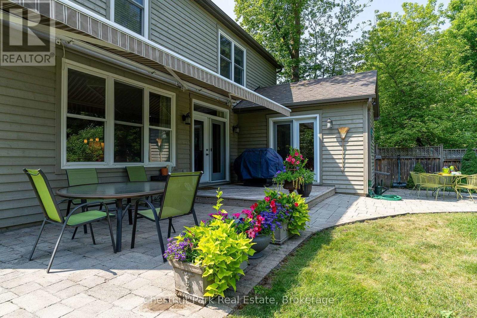 Private backyard deck with expansive sun awning - 71 Hickory Street, Collingwood, ON - Outdoor With Deck Patio Veranda