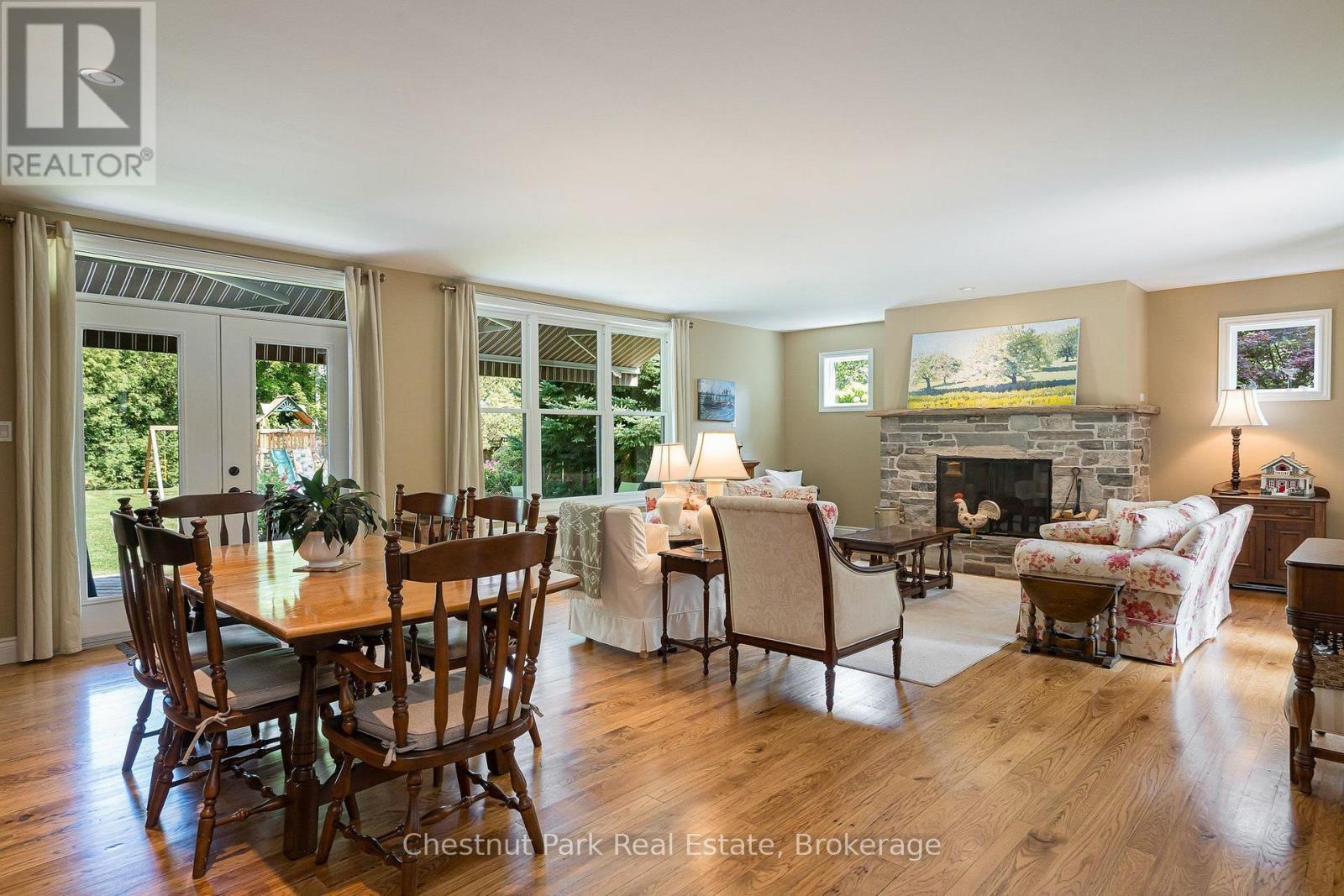 Walk out from dining area to private backyard - 71 Hickory Street, Collingwood, ON - Indoor With Fireplace