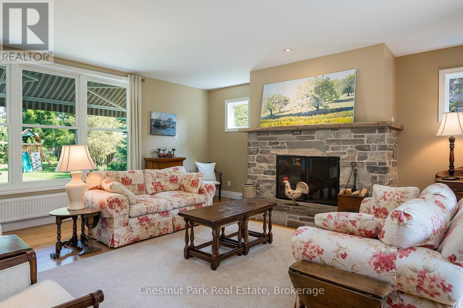 Cozy wood burning fireplace for cold winter nights - 71 Hickory Street, Collingwood, ON - Indoor Photo Showing Living Room With Fireplace