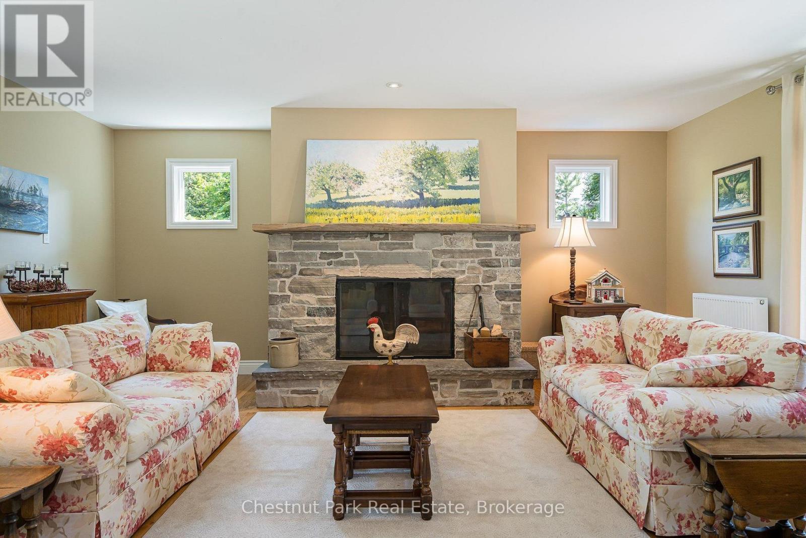 Wood burning fireplace in the living room - 71 Hickory Street, Collingwood, ON - Indoor Photo Showing Living Room With Fireplace