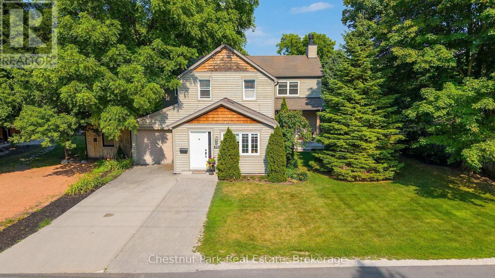 Parking in the driveway for 2 cars and 1 in garage - 71 Hickory Street, Collingwood, ON - Outdoor With Facade