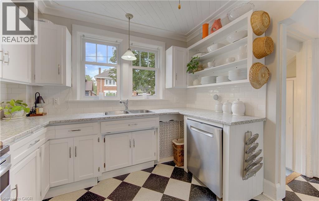 White cabinetry with silver hardware, speckled countertops, stainless steel dishwasher, and open shelving - 150 Union Boulevard, Kitchener, ON - Indoor Photo Showing Kitchen With Double Sink