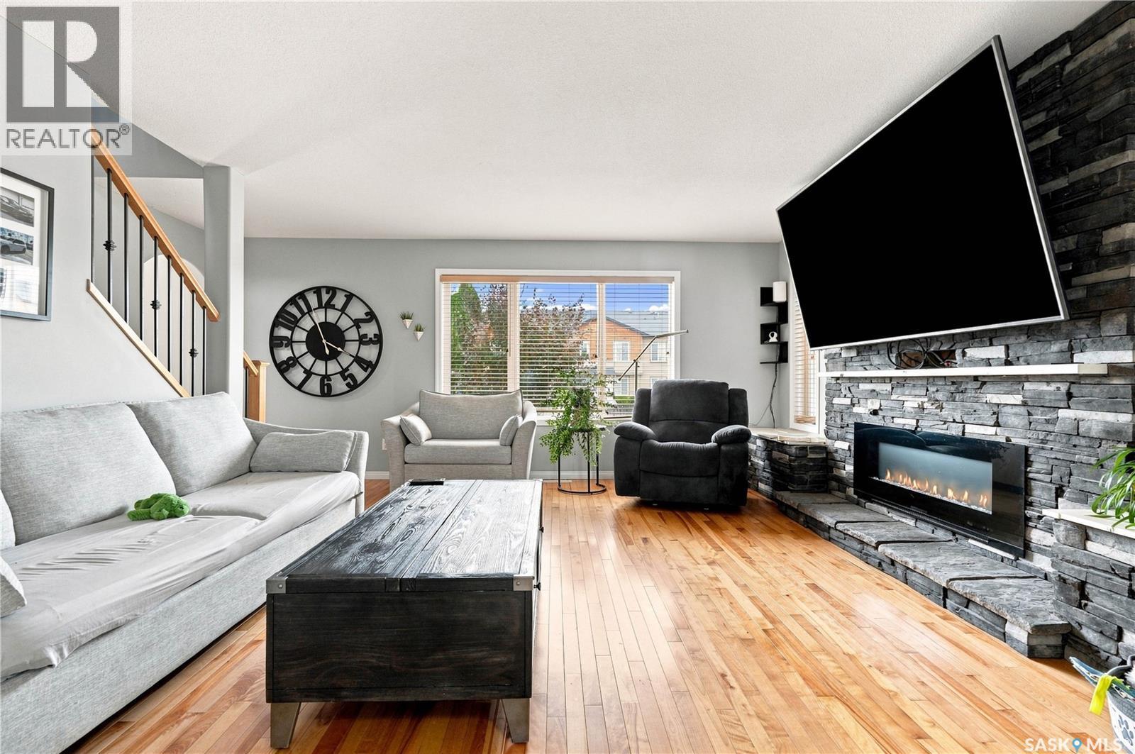 3010 37Th Street W, Saskatoon, SK - Indoor Photo Showing Living Room With Fireplace