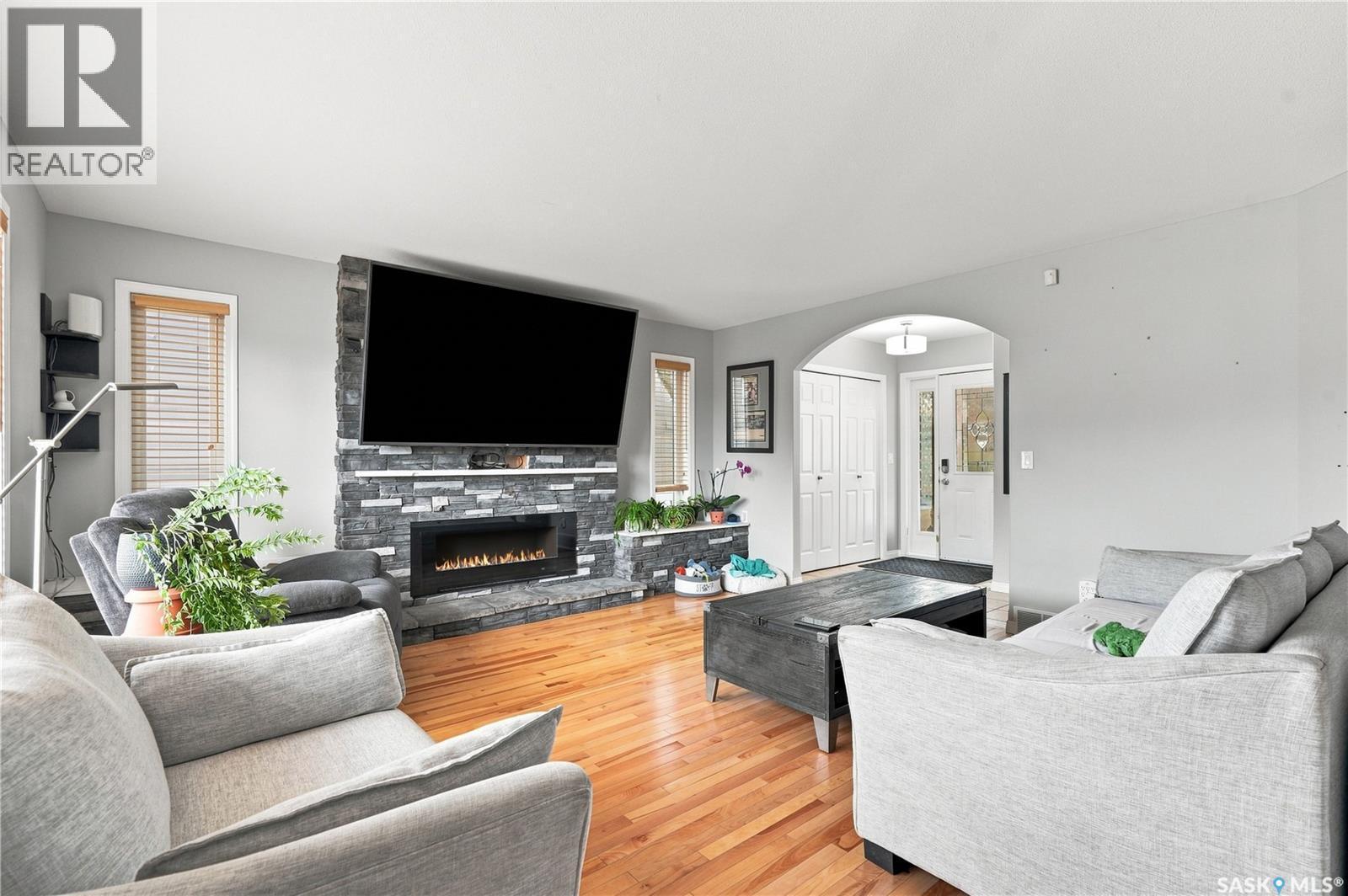 3010 37Th Street W, Saskatoon, SK - Indoor Photo Showing Living Room With Fireplace