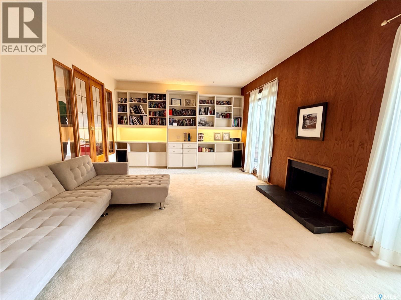 2173 Douglas Avenue, North Battleford, SK - Indoor Photo Showing Other Room With Fireplace