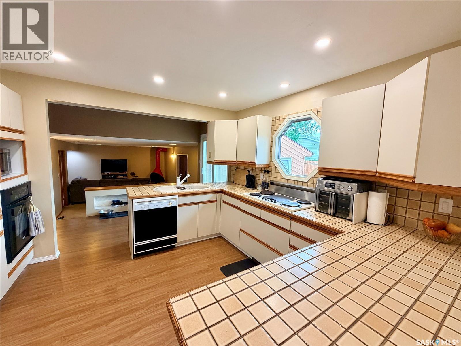 2173 Douglas Avenue, North Battleford, SK - Indoor Photo Showing Kitchen With Fireplace