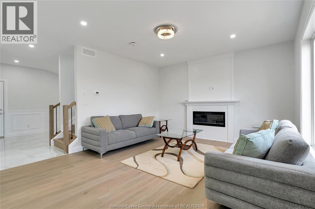 33 Eagle, Leamington, ON - Indoor Photo Showing Living Room With Fireplace