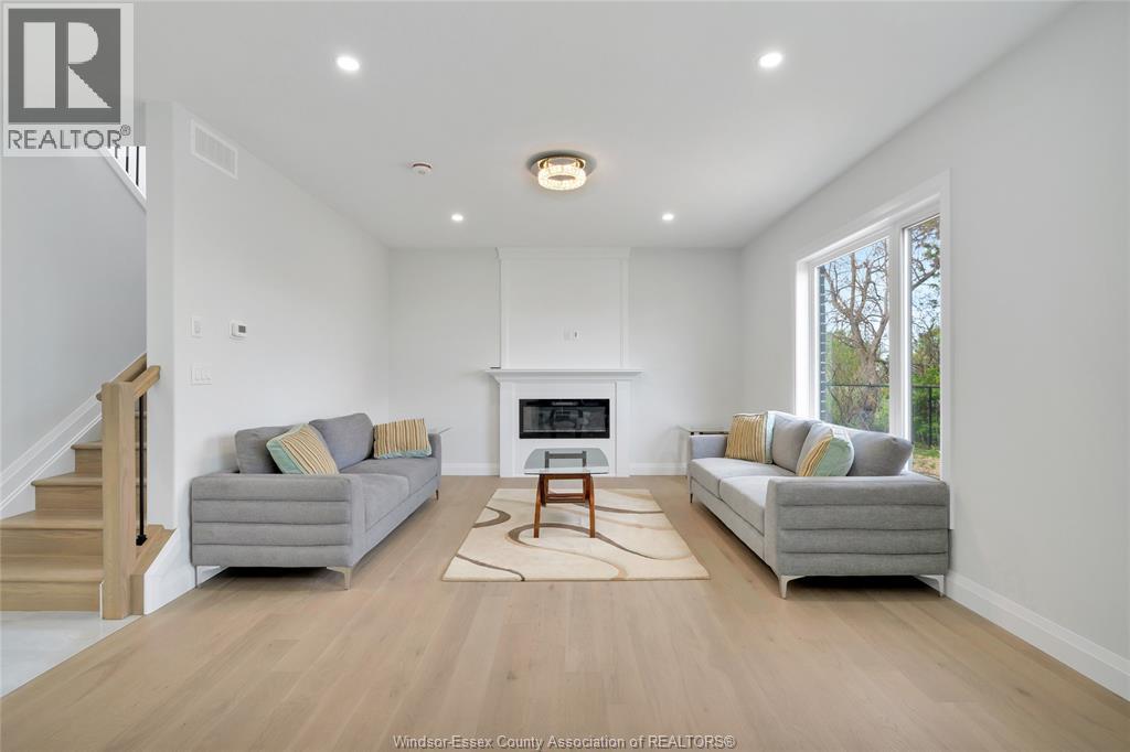 33 Eagle, Leamington, ON - Indoor Photo Showing Living Room With Fireplace