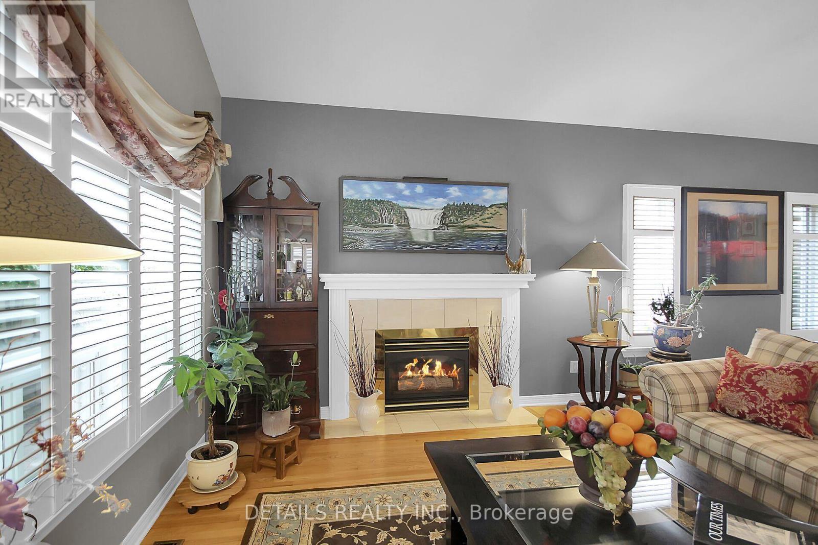 65 Kimberwick Crescent, Ottawa, ON - Indoor Photo Showing Living Room With Fireplace