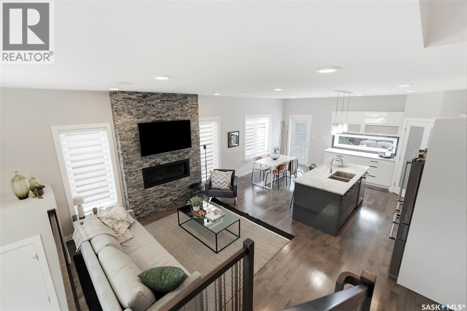 130 Boykowich Bend, Saskatoon, SK - Indoor Photo Showing Living Room With Fireplace