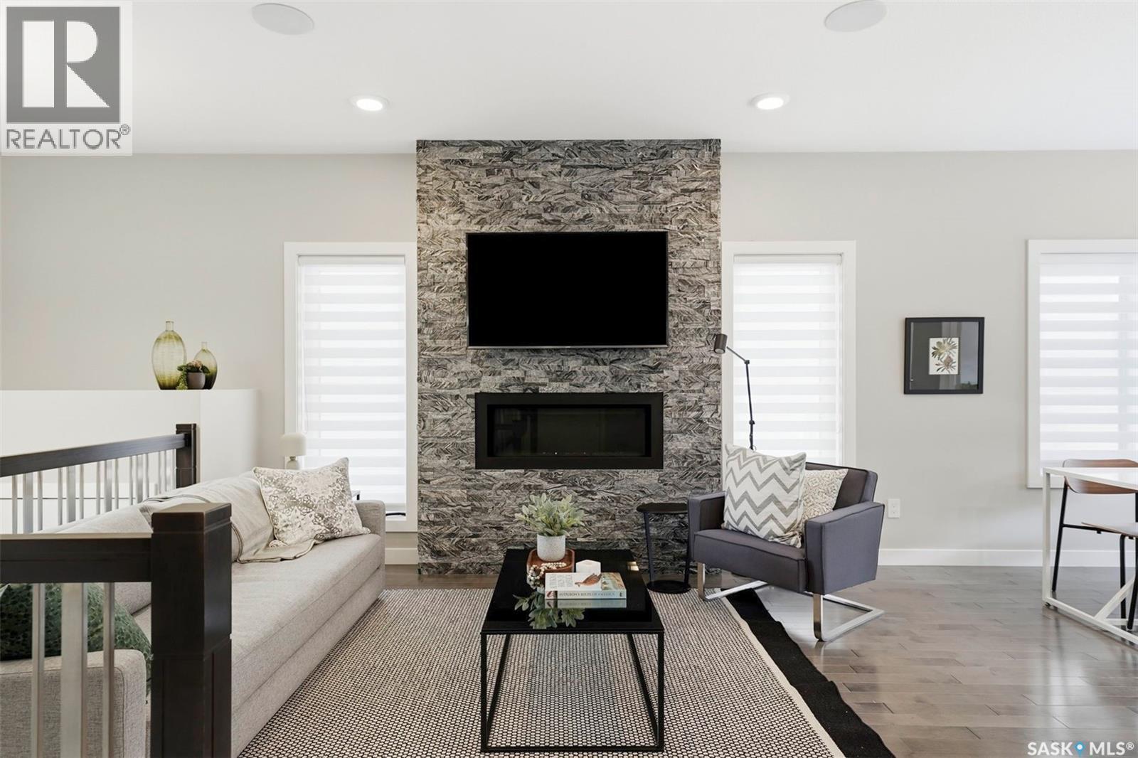 130 Boykowich Bend, Saskatoon, SK - Indoor Photo Showing Living Room With Fireplace