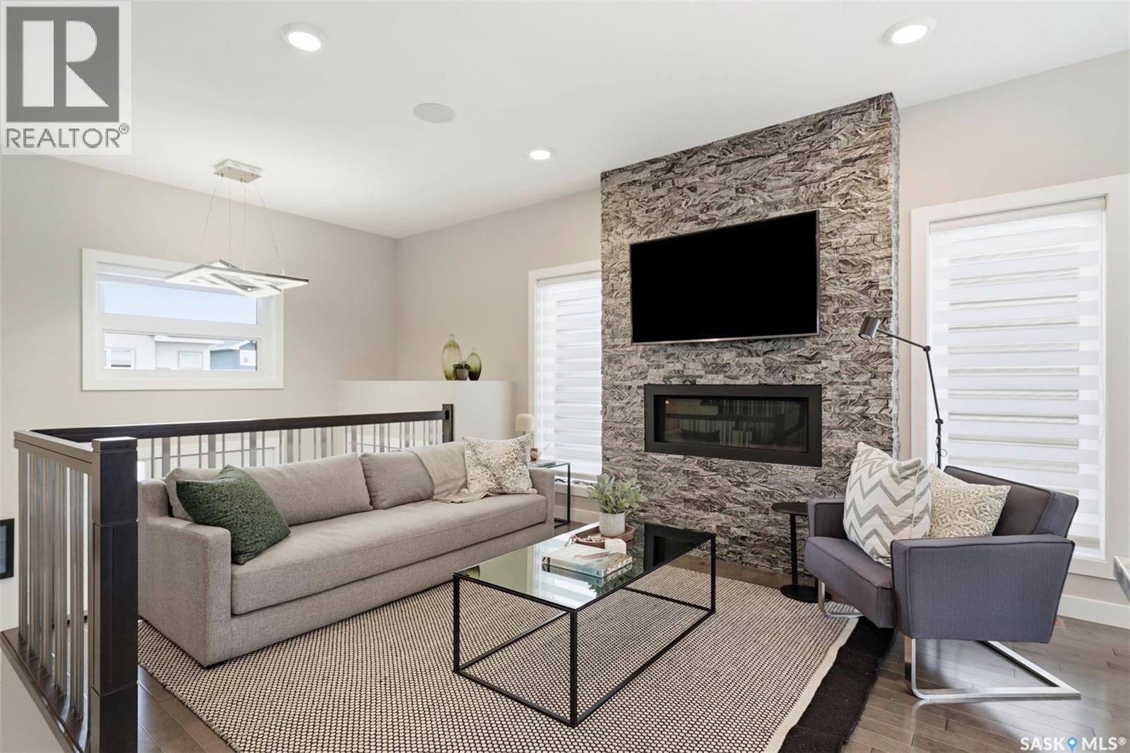 130 Boykowich Bend, Saskatoon, SK - Indoor Photo Showing Living Room With Fireplace