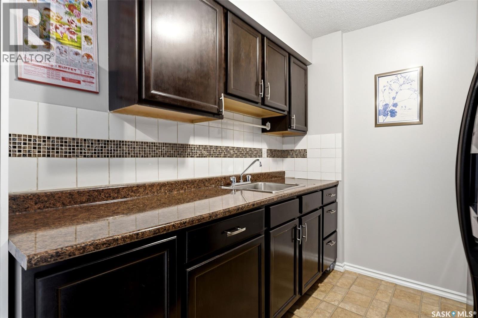 4168 Castle Road, Regina, SK - Indoor Photo Showing Kitchen With Double Sink