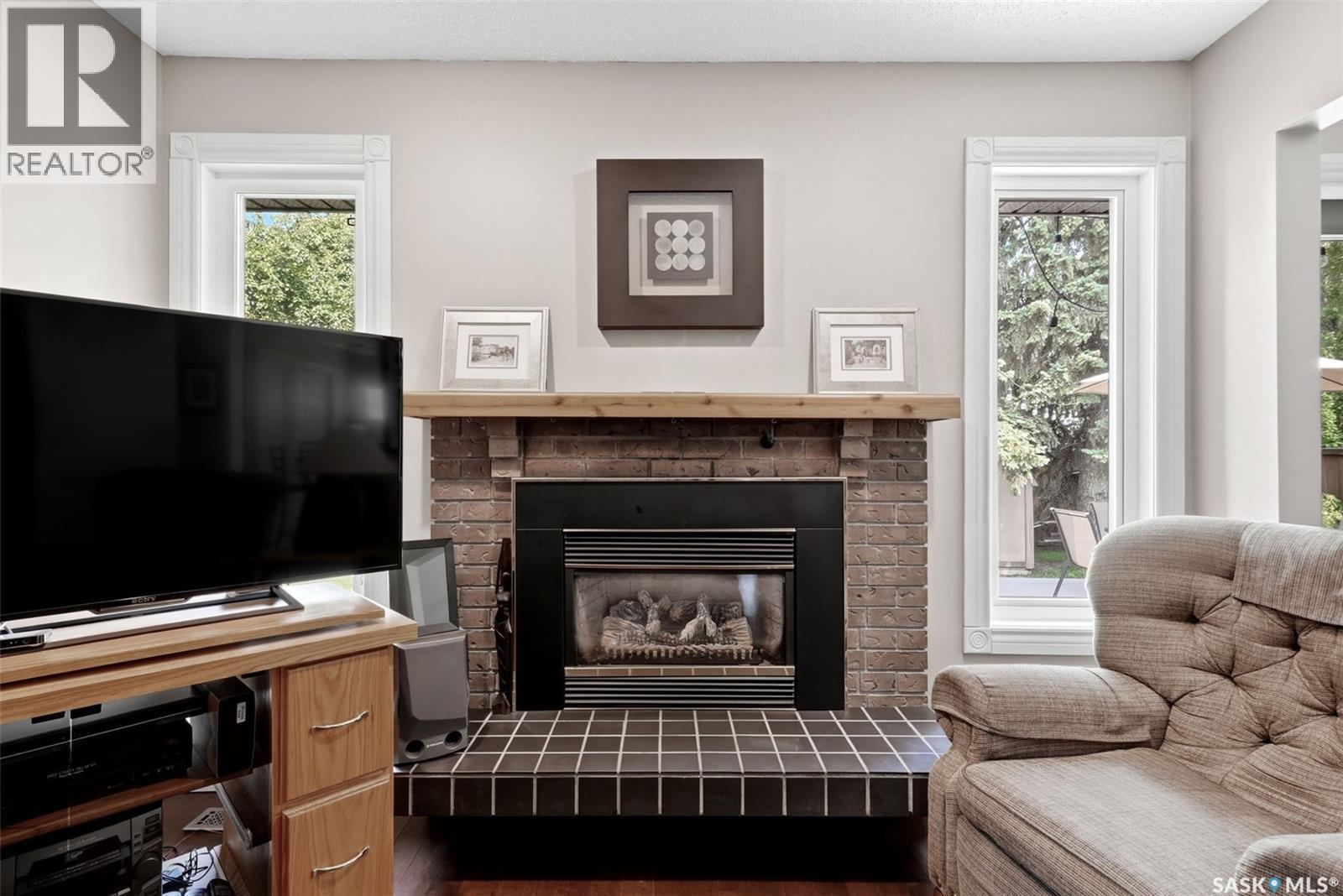2118 Elderkin Drive E, Regina, SK - Indoor Photo Showing Living Room With Fireplace