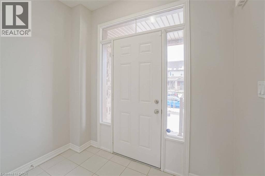 Entryway featuring a white paneled door, transom window, and sidelights - 70 Bradbury Road, Hamilton, ON - Indoor Photo Showing Other Room