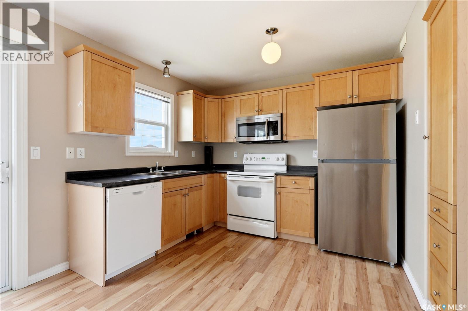 52 118 Pawlychenko Lane, Saskatoon, SK - Indoor Photo Showing Kitchen With Double Sink