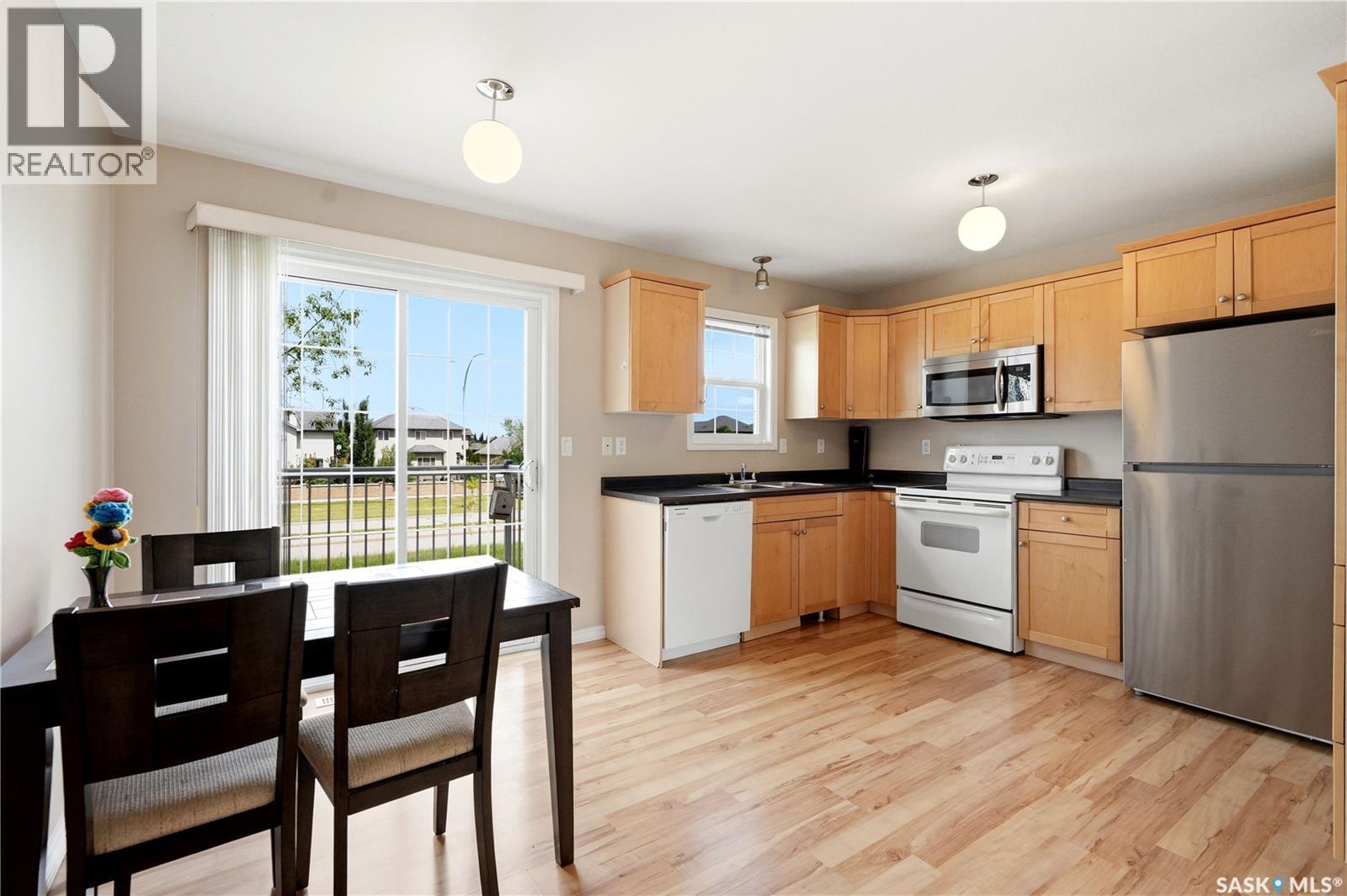 52 118 Pawlychenko Lane, Saskatoon, SK - Indoor Photo Showing Kitchen With Double Sink