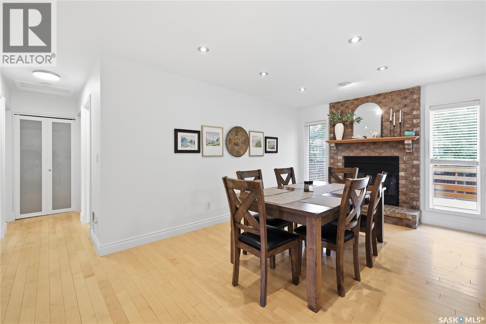 2206 Assiniboine Avenue E, Regina, SK - Indoor Photo Showing Dining Room With Fireplace