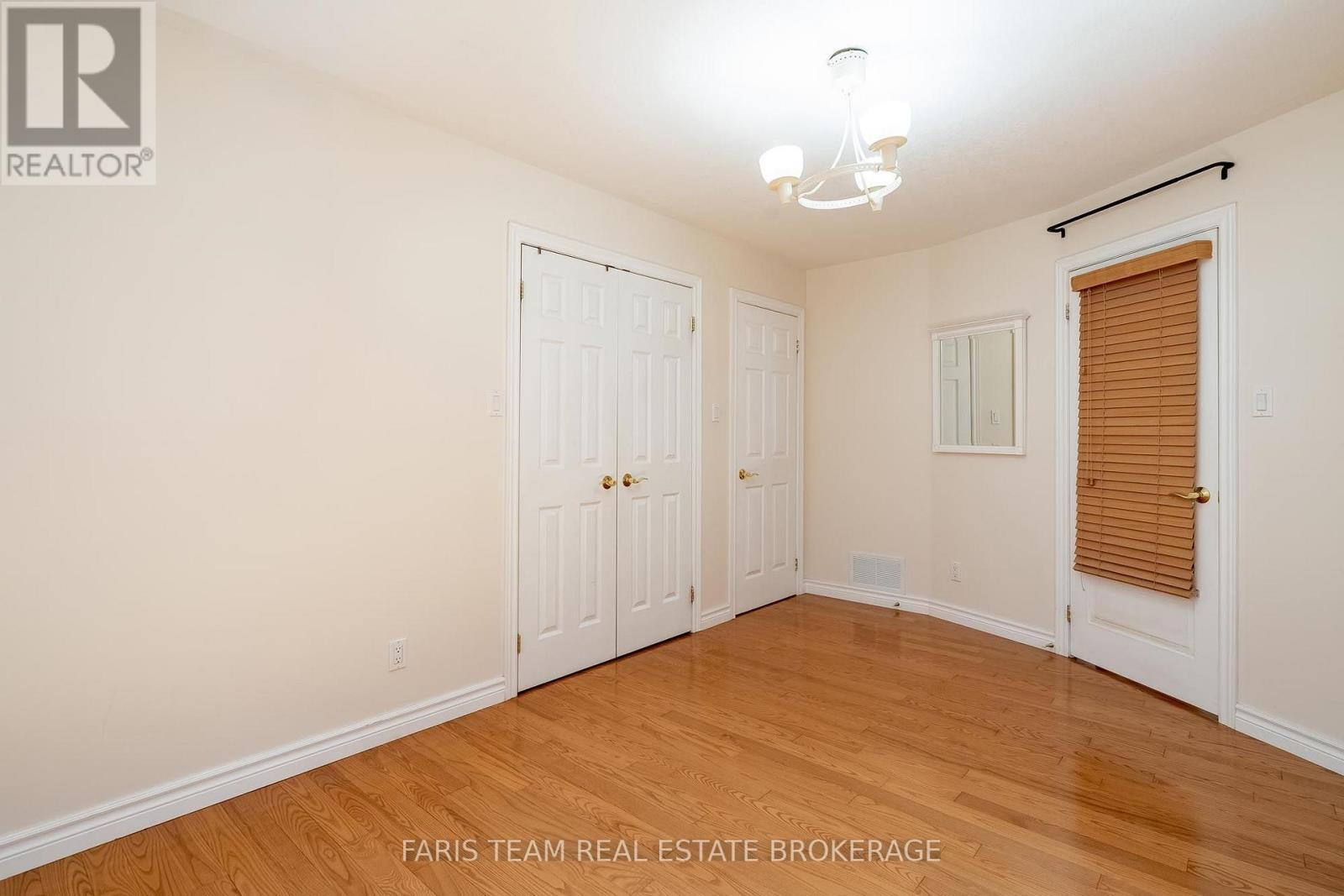91 Maryjane Road, Tiny, ON - Indoor Photo Showing Other Room