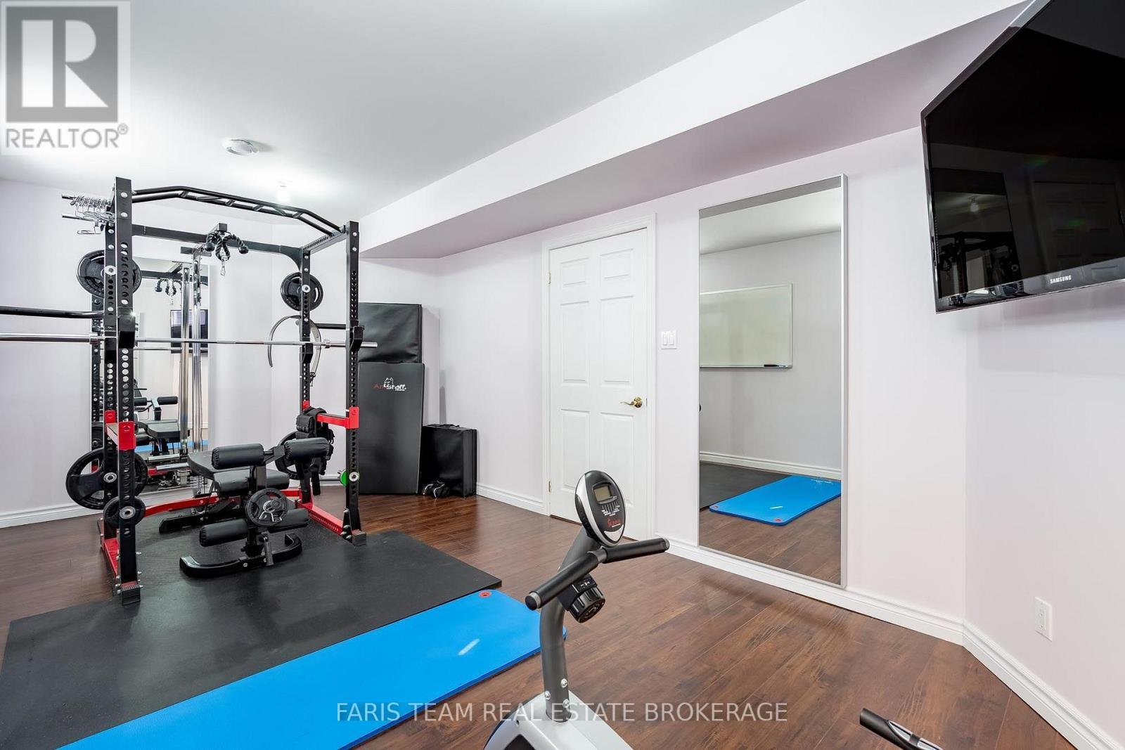 91 Maryjane Road, Tiny, ON - Indoor Photo Showing Gym Room