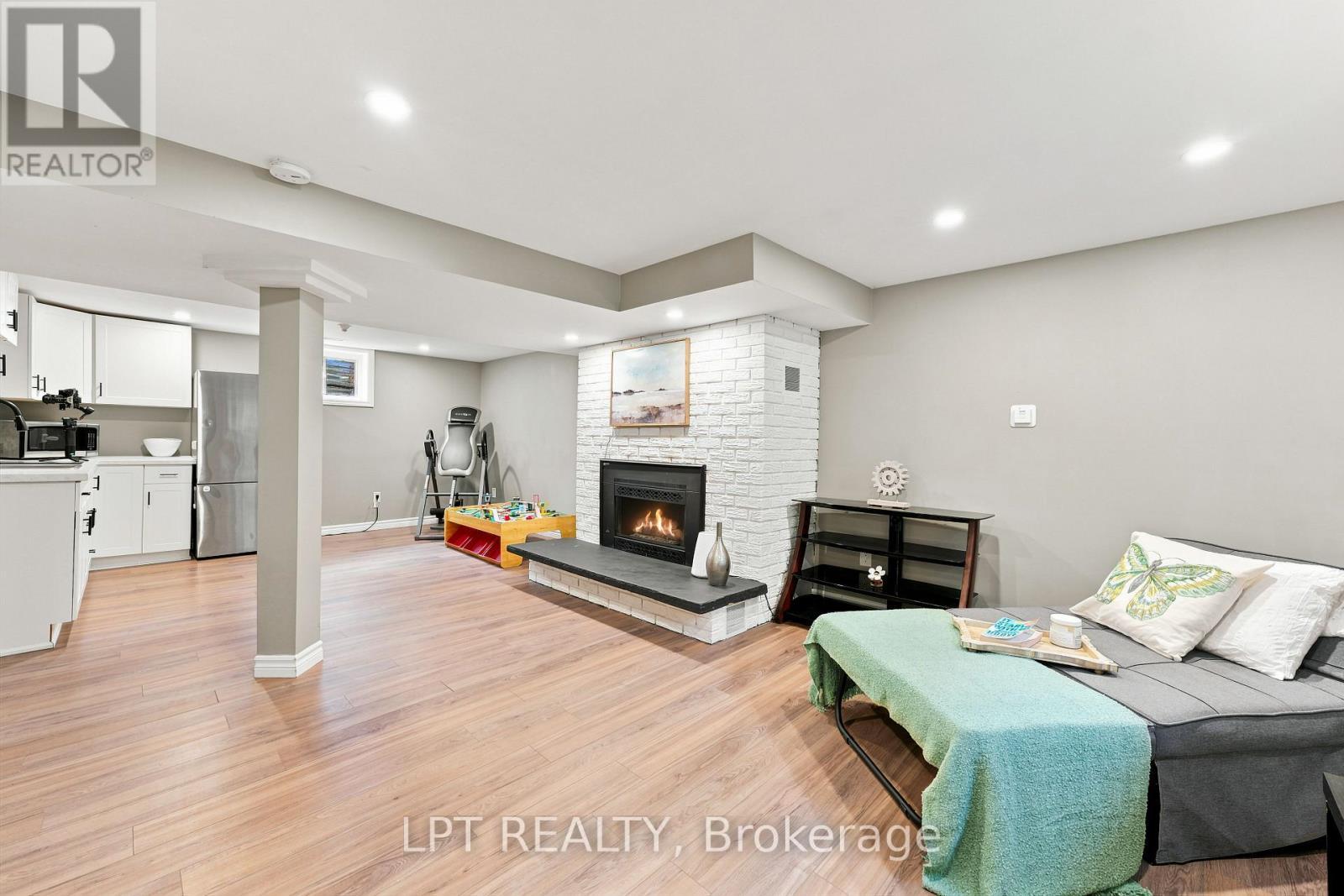 Finished Basement w Gas Fireplace - 2628 Westshore Crescent, Severn, ON - Indoor With Fireplace
