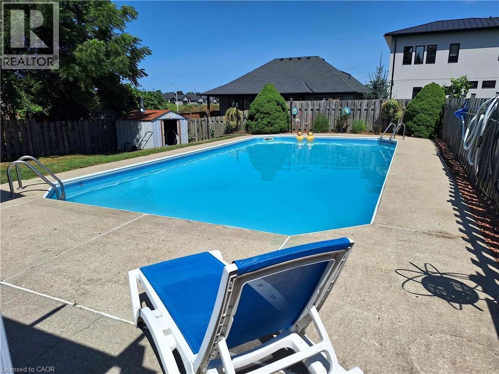 48 Crestlynn Crescent, Simcoe, ON - Outdoor With In Ground Pool With Backyard