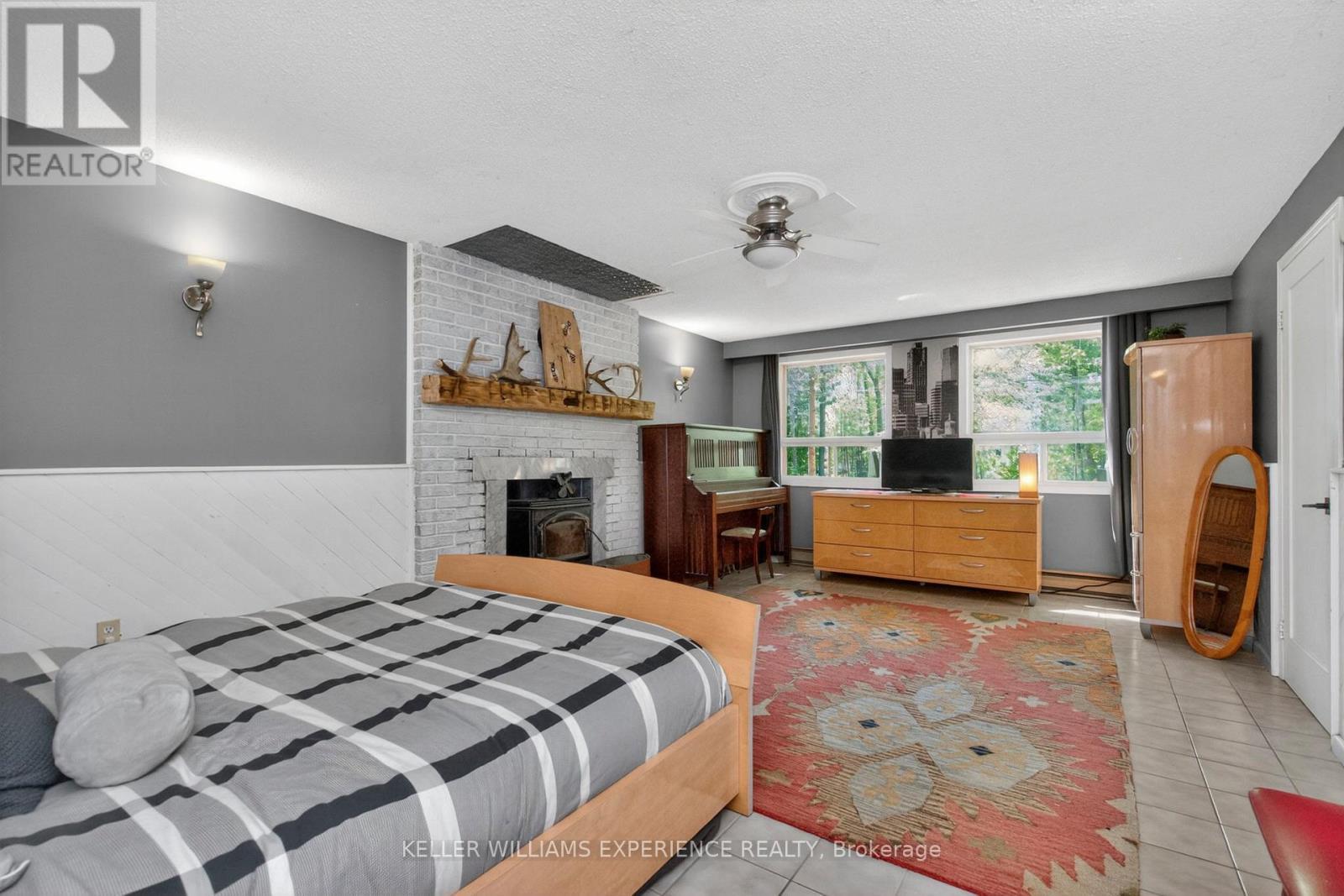 181 Park Road, Tiny, ON - Indoor Photo Showing Bedroom With Fireplace
