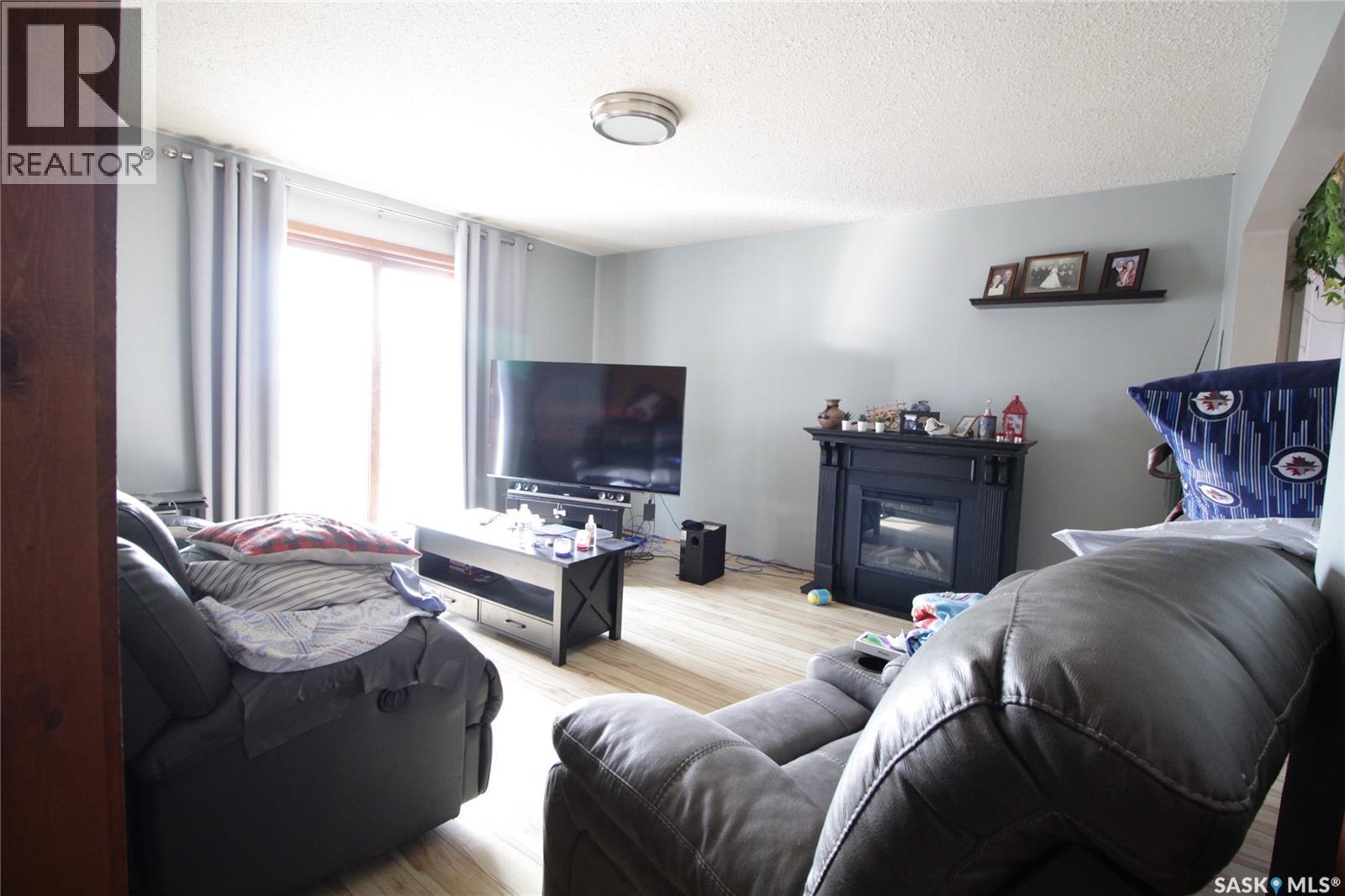 Letendre Acreage, Rocanville Rm No. 151, SK - Indoor Photo Showing Living Room With Fireplace