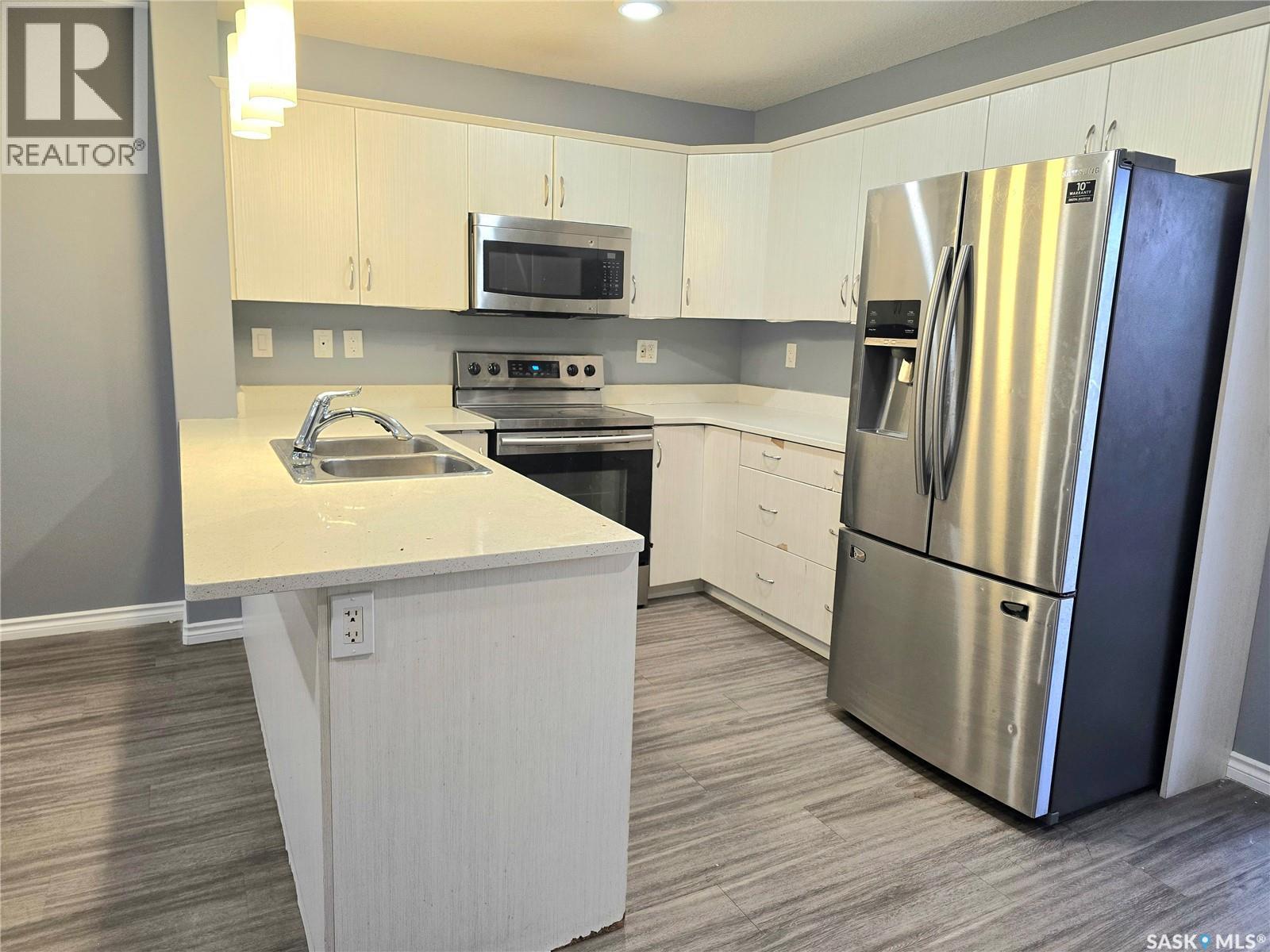 510 110 Akhtar Bend, Saskatoon, SK - Indoor Photo Showing Kitchen With Double Sink