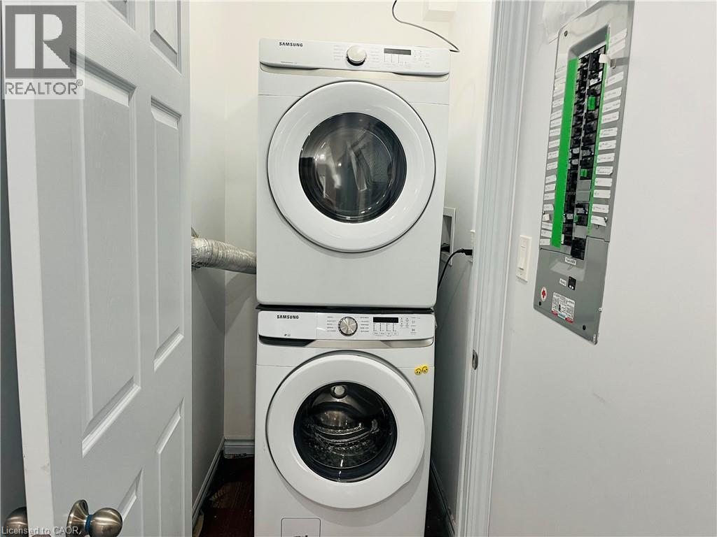 Stackable laundry appliances - 83 Keewatin Avenue, Kitchener, ON - Indoor Photo Showing Laundry Room