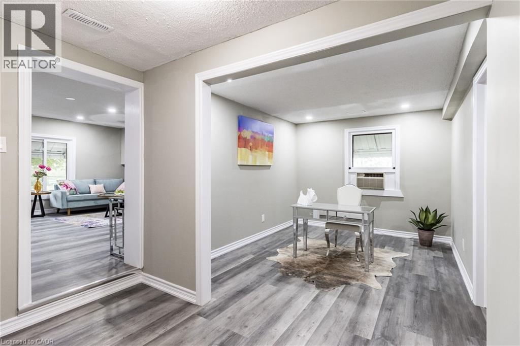 Recessed lighting, light gray walls, wood-finish flooring, white trim, and a window for natural light - 15 Spiers Crescent, Cambridge, ON - Indoor