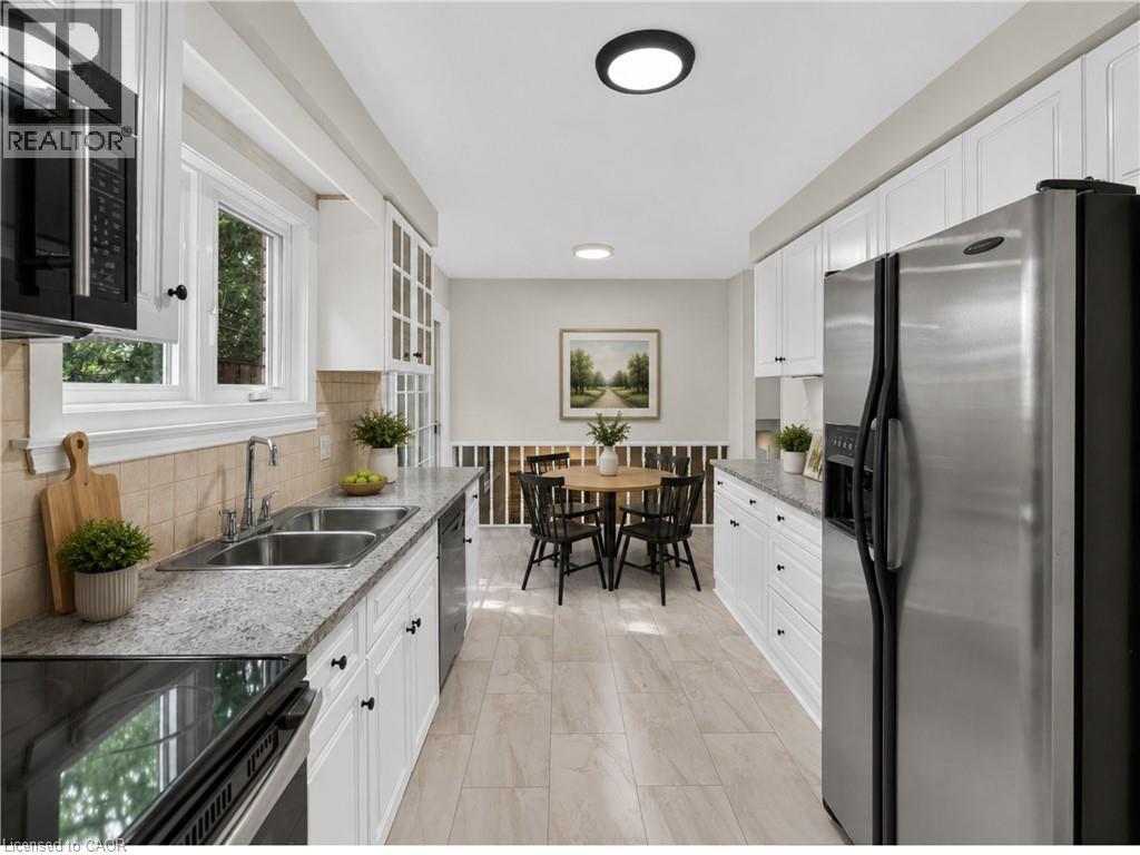 Virtually Staged. - 3401 Rockwood Drive, Burlington, ON - Indoor Photo Showing Kitchen With Double Sink