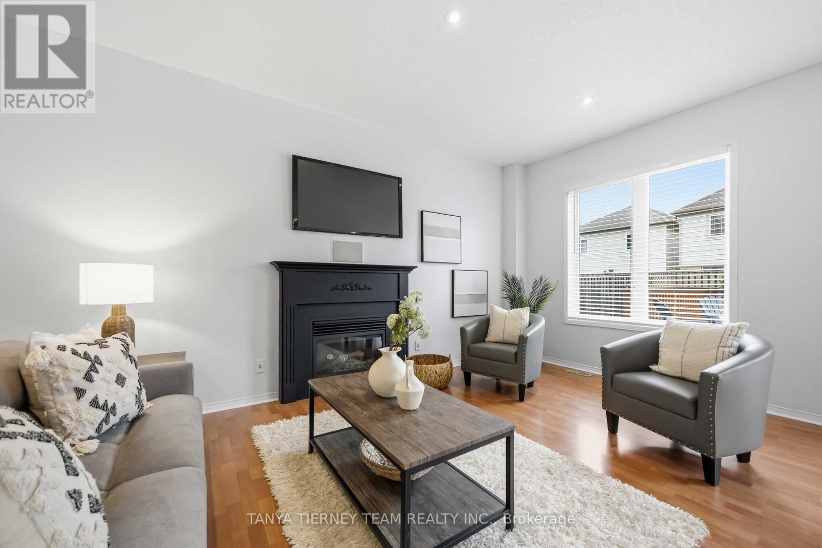 75 Robert Attersley Drive E, Whitby, ON - Indoor Photo Showing Living Room With Fireplace