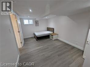 Wood-finish flooring, recessed lighting, and a window for natural light - 510 Oakridge Place, Waterloo, ON - Indoor