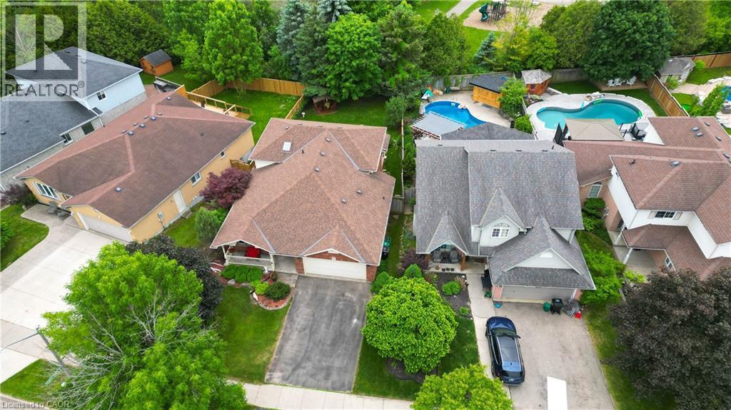 Aerial view showcasing a residential property with a multi-gabled roofline and attached garage - 599 Coldstream Drive, Waterloo, ON - Outdoor