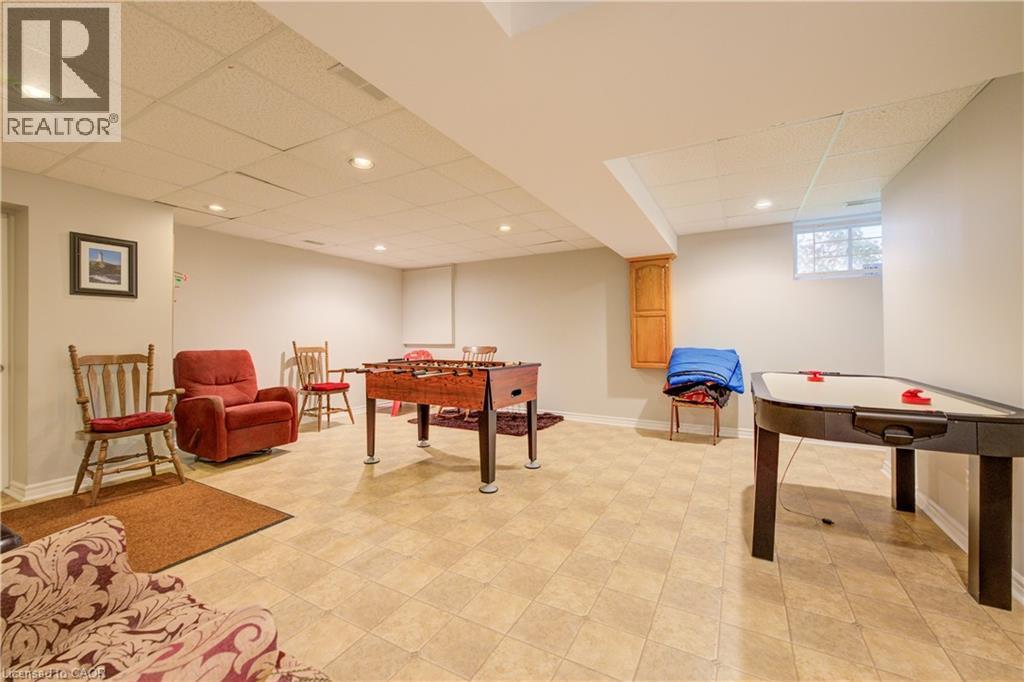 Spacious finished lower level featuring recessed lighting, a drop ceiling, and light-toned floor tiles - 599 Coldstream Drive, Waterloo, ON - Indoor