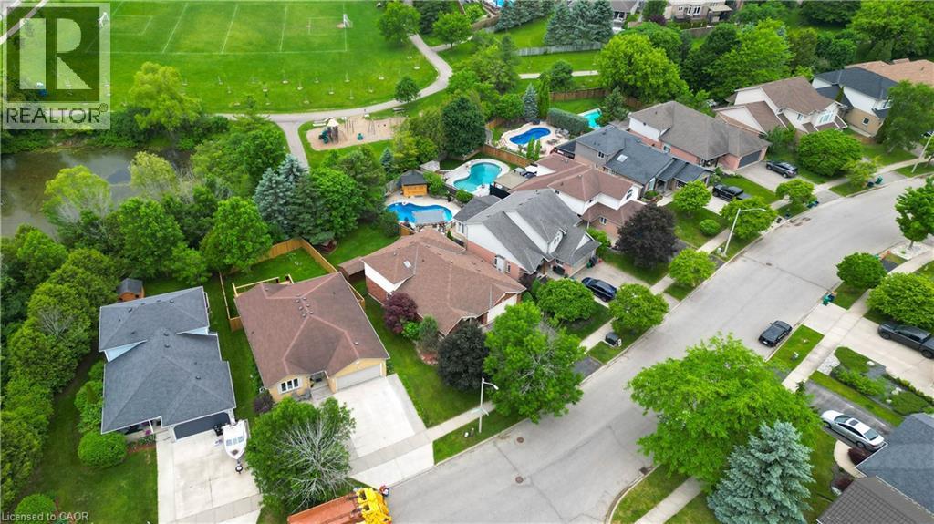 Aerial perspective showcasing a residential street with multiple detached homes - 599 Coldstream Drive, Waterloo, ON - Outdoor With View