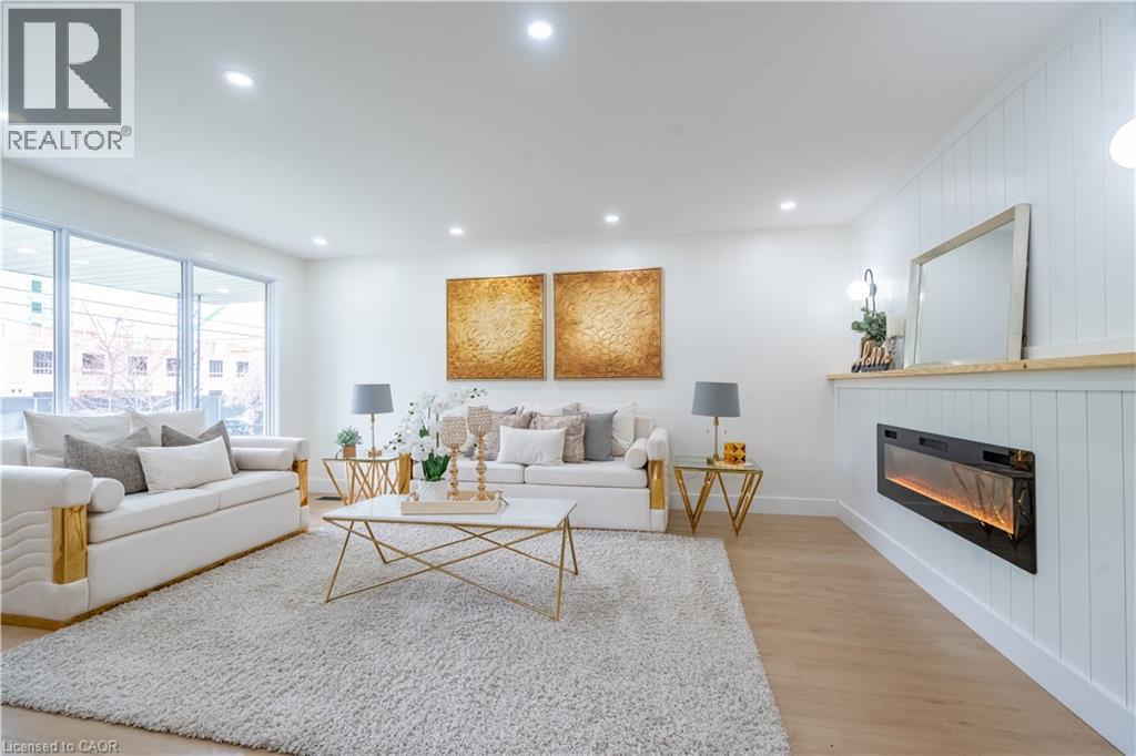 23 Tyrone Drive, Hamilton, ON - Indoor Photo Showing Living Room With Fireplace