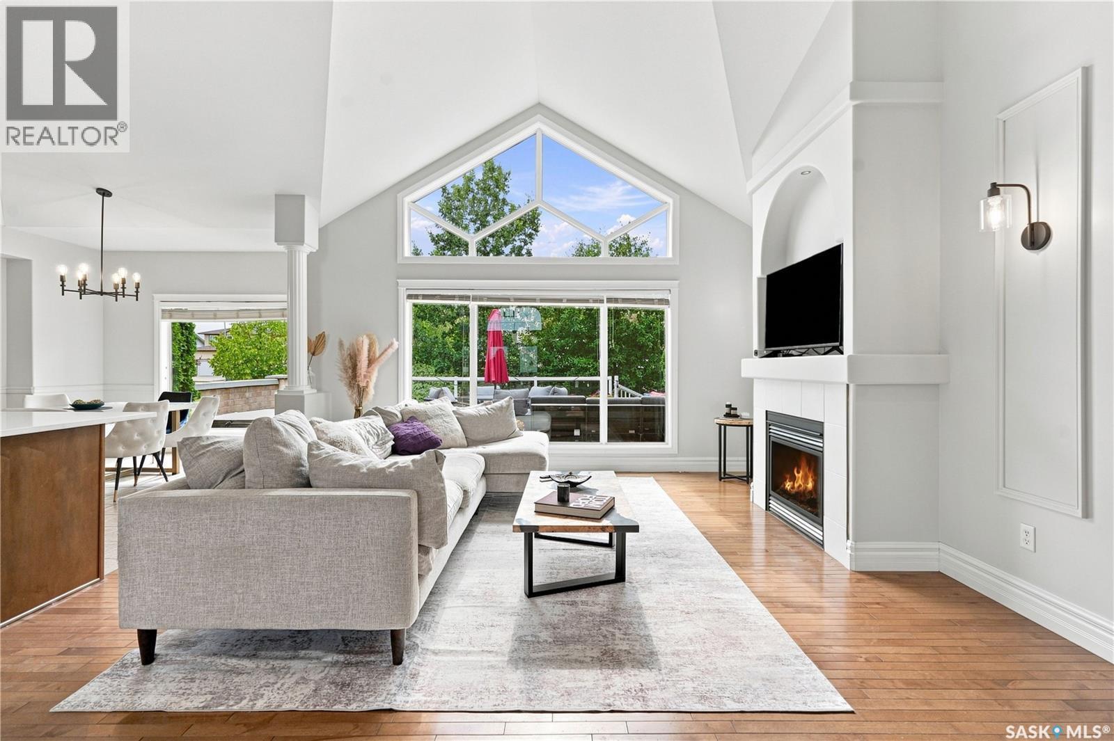102 Brookdale Crescent, Saskatoon, SK - Indoor Photo Showing Living Room With Fireplace