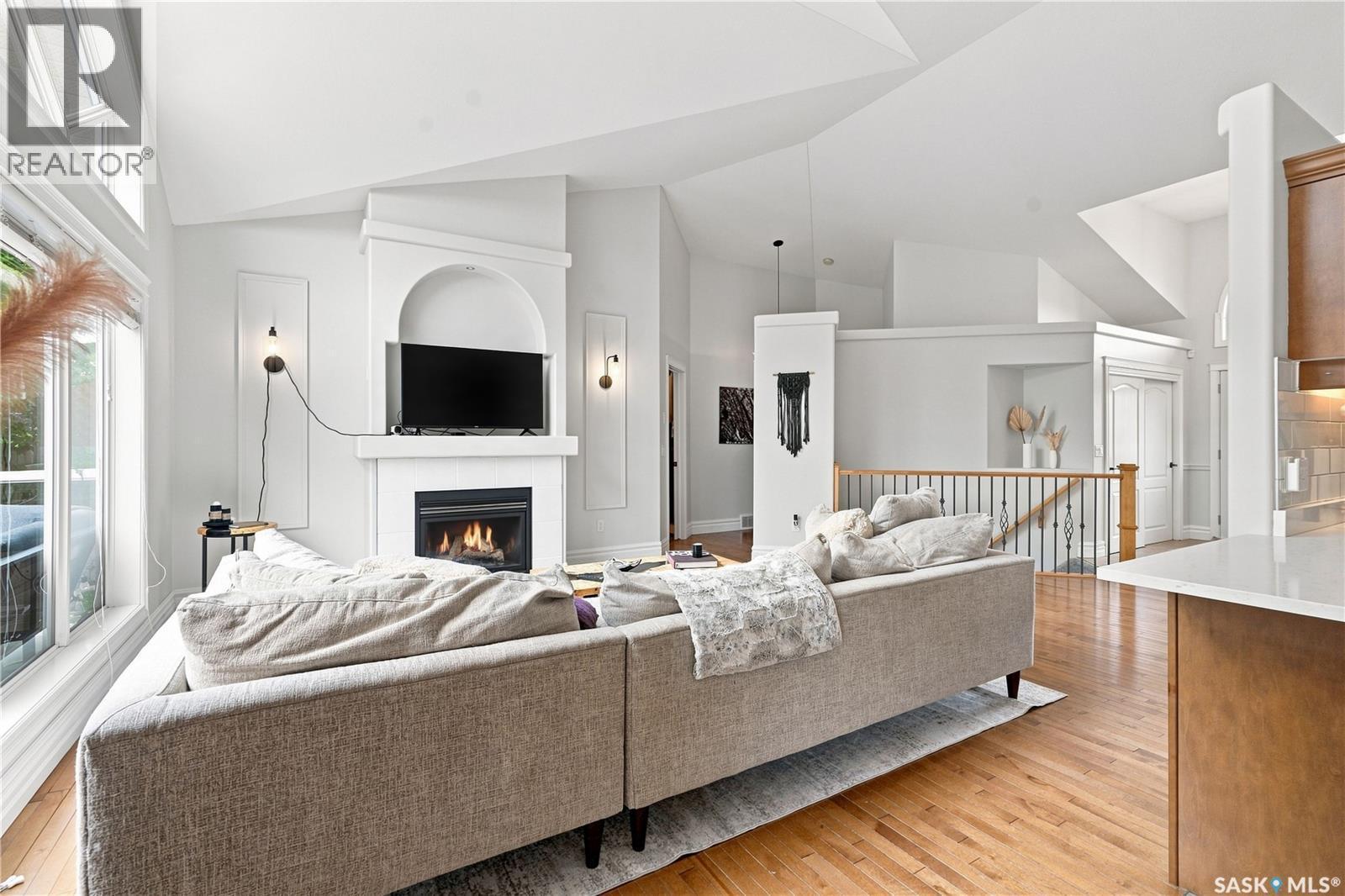 102 Brookdale Crescent, Saskatoon, SK - Indoor Photo Showing Living Room With Fireplace